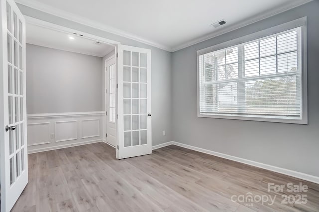 9934 Cask Way, Huntersville, NC 28078 - empty room featuring french doors, ornamental molding, wood finished floors, and baseboards