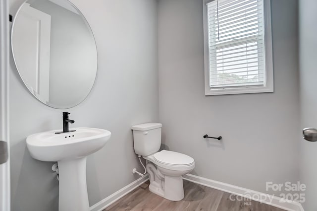 9934 Cask Way, Huntersville, NC 28078 - bathroom with baseboards, wood finished floors, and toilet