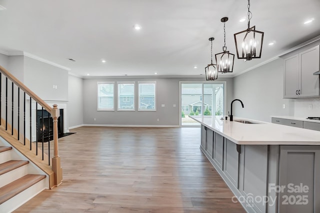 9934 Cask Way, Huntersville, NC 28078 - kitchen featuring gray cabinetry, a sink, ornamental molding, recessed lighting, and light countertops