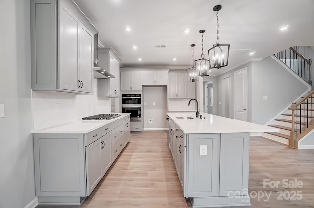 9934 Cask Way, Huntersville, NC 28078 - kitchen featuring a sink, gas stovetop, light wood-type flooring, gray cabinets, and recessed lighting
