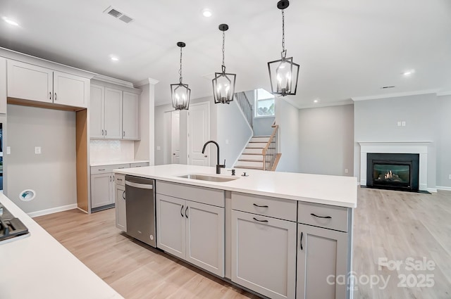 9934 Cask Way, Huntersville, NC 28078 - kitchen featuring stainless steel dishwasher, a sink, gray cabinets, light wood-type flooring, and a chandelier