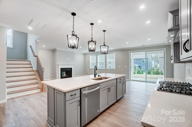 9934 Cask Way, Huntersville, NC 28078 - kitchen with appliances with stainless steel finishes, a sink, gray cabinets, light wood-type flooring, and recessed lighting