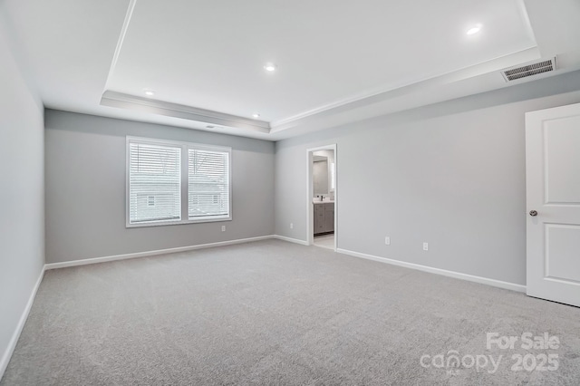 9934 Cask Way, Huntersville, NC 28078 - unfurnished bedroom with a tray ceiling, baseboards, light carpet, and recessed lighting