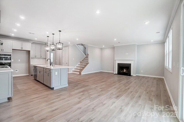 9934 Cask Way, Huntersville, NC 28078 - kitchen featuring stainless steel dishwasher, light countertops, gray cabinets, recessed lighting, and a fireplace with flush hearth