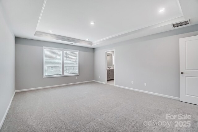 9934 Cask Way, Huntersville, NC 28078 - unfurnished bedroom with a raised ceiling, light colored carpet, recessed lighting, and ensuite bath