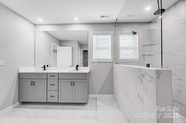 9934 Cask Way, Huntersville, NC 28078 - bathroom featuring marble finish floors, double vanity, a marble finish shower, and recessed lighting