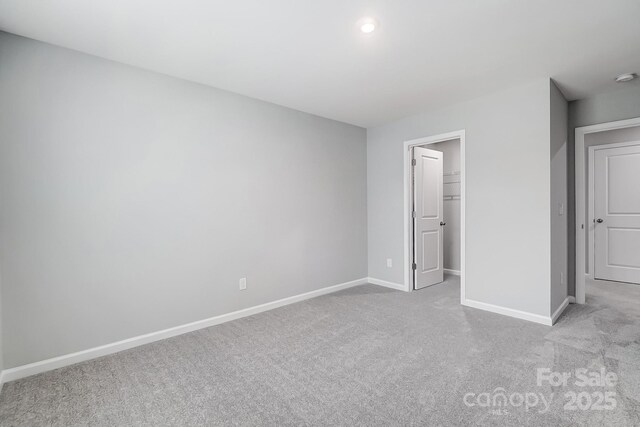 9934 Cask Way, Huntersville, NC 28078 - unfurnished bedroom with carpet floors and a walk in closet