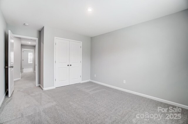 9934 Cask Way, Huntersville, NC 28078 - unfurnished bedroom with carpet floors, a closet, and recessed lighting