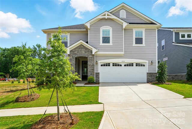 9934 Cask Way, Huntersville, NC 28078 - craftsman house with stone siding, driveway, an attached garage, and a front lawn