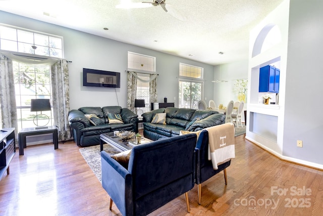 2936 Walsingham Ct, Matthews, NC 28105 - living room with a textured ceiling, a ceiling fan, and wood finished floors
