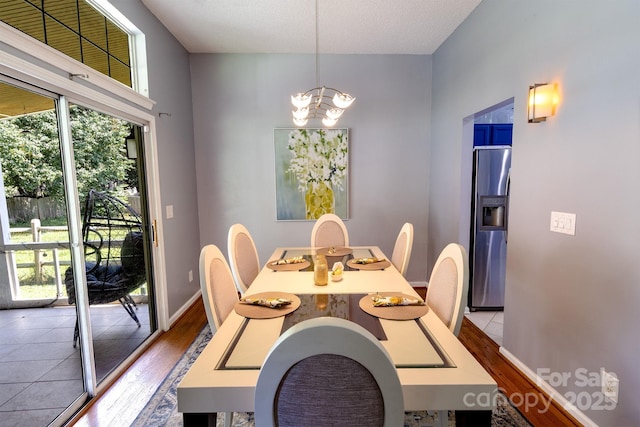 2936 Walsingham Ct, Matthews, NC 28105 - dining room with a chandelier and wood finished floors