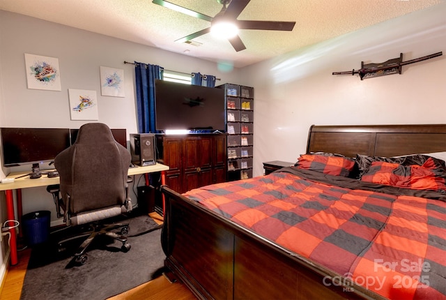 2936 Walsingham Ct, Matthews, NC 28105 - bedroom with a textured ceiling, an office area, wood finished floors, and ceiling fan