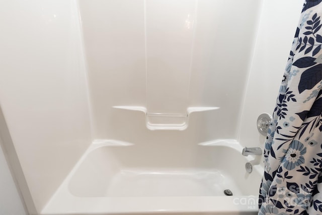 2936 Walsingham Ct, Matthews, NC 28105 - bathroom featuring shower / bathtub combination with curtain