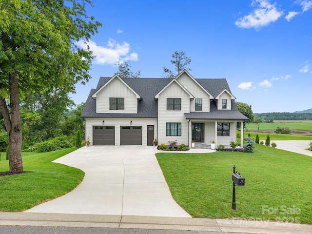 301 Rockbridge Rd Unit 22, Mills River, NC 28759 - modern farmhouse with a garage, board and batten siding, concrete driveway, and a front lawn