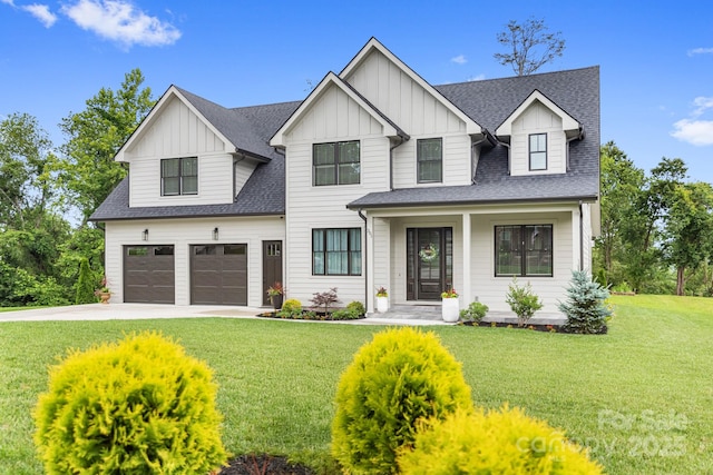 301 Rockbridge Rd Unit 22, Mills River, NC 28759 - modern farmhouse style home with board and batten siding, concrete driveway, an attached garage, roof with shingles, and a front yard