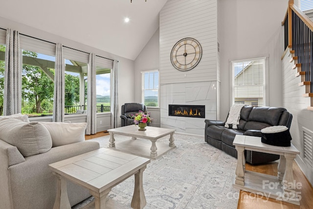 301 Rockbridge Rd Unit 22, Mills River, NC 28759 - living room featuring high vaulted ceiling, stairs, plenty of natural light, a fireplace, and recessed lighting