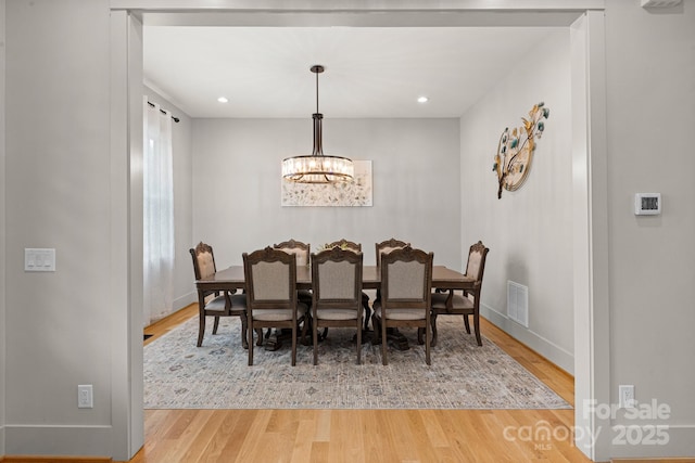 301 Rockbridge Rd Unit 22, Mills River, NC 28759 - dining area with a chandelier, wood finished floors, baseboards, and recessed lighting