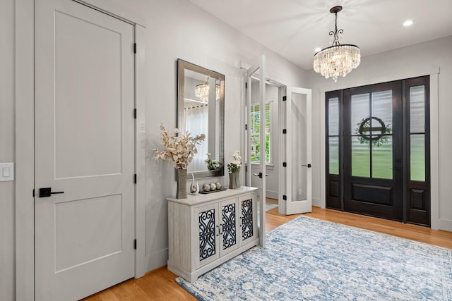 301 Rockbridge Rd Unit 22, Mills River, NC 28759 - foyer entrance with a chandelier, light wood-style flooring, and baseboards