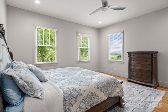 301 Rockbridge Rd Unit 22, Mills River, NC 28759 - bedroom with multiple windows, recessed lighting, baseboards, and light wood-style flooring
