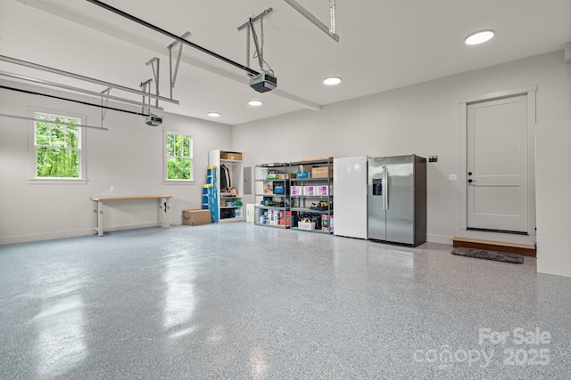 301 Rockbridge Rd Unit 22, Mills River, NC 28759 - garage with stainless steel fridge with ice dispenser, a garage door opener, baseboards, and recessed lighting