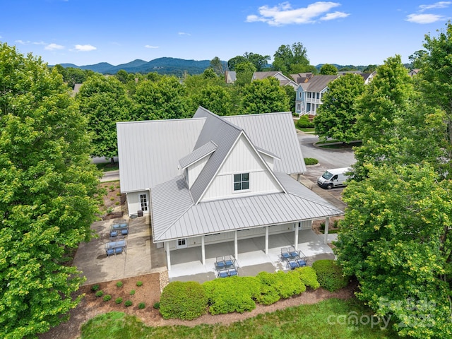 301 Rockbridge Rd Unit 22, Mills River, NC 28759 - back of property featuring a patio area, a standing seam roof, metal roof, and board and batten siding