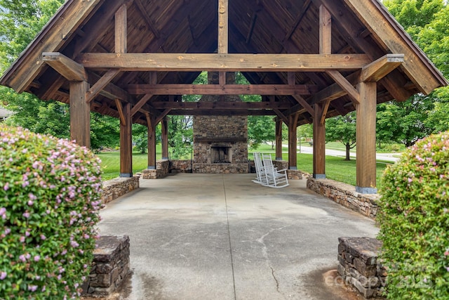 301 Rockbridge Rd Unit 22, Mills River, NC 28759 - view of patio / terrace with a gazebo, an outdoor stone fireplace, a carport, and driveway