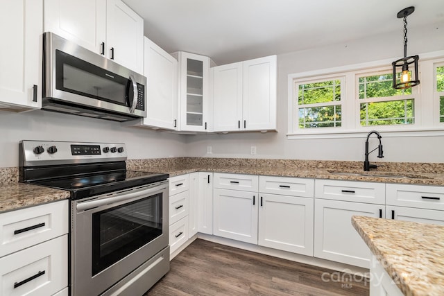 1632 Charles Raper Jonas Hwy, Mount Holly, NC 28120 - kitchen featuring stainless steel appliances, a sink, white cabinets, glass insert cabinets, and dark wood-style flooring