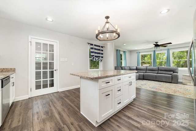 1632 Charles Raper Jonas Hwy, Mount Holly, NC 28120 - kitchen with dishwasher, dark wood-style flooring, a chandelier, ceiling fan, and white cabinets