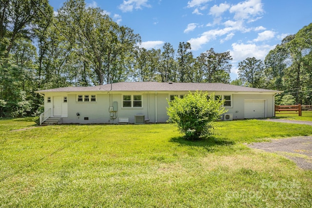 1632 Charles Raper Jonas Hwy, Mount Holly, NC 28120 - rear view of property featuring entry steps, gravel driveway, an attached garage, and central AC unit