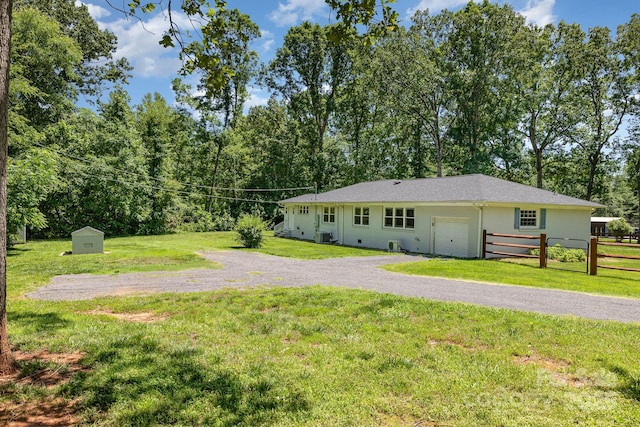 1632 Charles Raper Jonas Hwy, Mount Holly, NC 28120 - rear view of property with gravel driveway and an attached garage