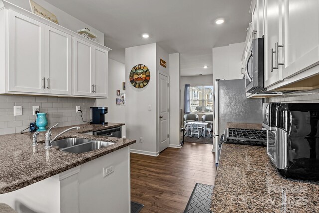 7172 Teague Dr, Gastonia, NC 28056 - kitchen with a sink, dark wood-style floors, white cabinets, dark stone counters, and recessed lighting