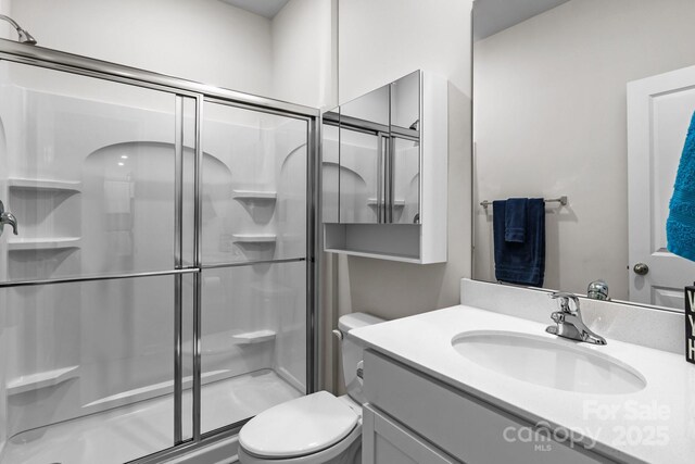 7172 Teague Dr, Gastonia, NC 28056 - full bath featuring toilet, a shower stall, and vanity