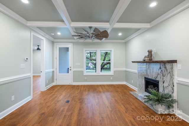 219 Grayson St, Sparta, NC 28675 - unfurnished living room with a high end fireplace, wood finished floors, ceiling fan, beam ceiling, and crown molding