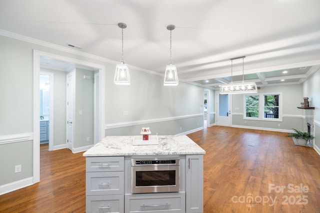 219 Grayson St, Sparta, NC 28675 - kitchen with gray cabinets, dark wood finished floors, open floor plan, hanging light fixtures, and ornamental molding