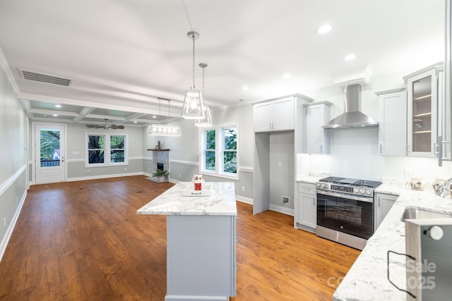 219 Grayson St, Sparta, NC 28675 - kitchen featuring stainless steel gas range oven, wall chimney exhaust hood, a sink, healthy amount of natural light, and recessed lighting