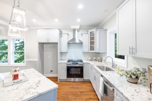 219 Grayson St, Sparta, NC 28675 - kitchen featuring appliances with stainless steel finishes, wall chimney range hood, a sink, crown molding, and light stone counters