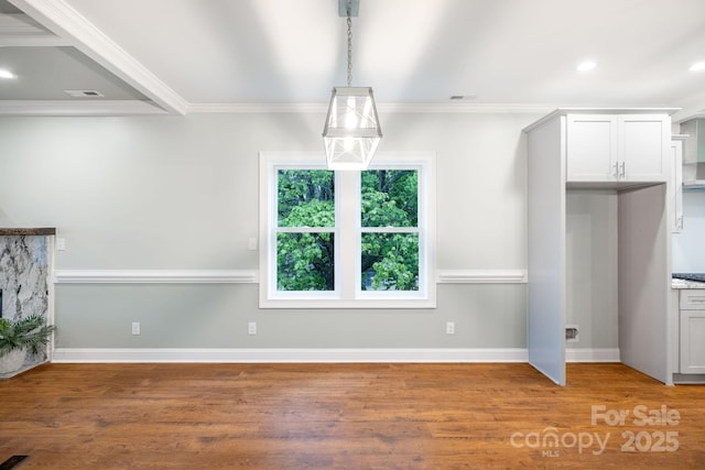 219 Grayson St, Sparta, NC 28675 - unfurnished dining area with light wood finished floors, crown molding, and baseboards