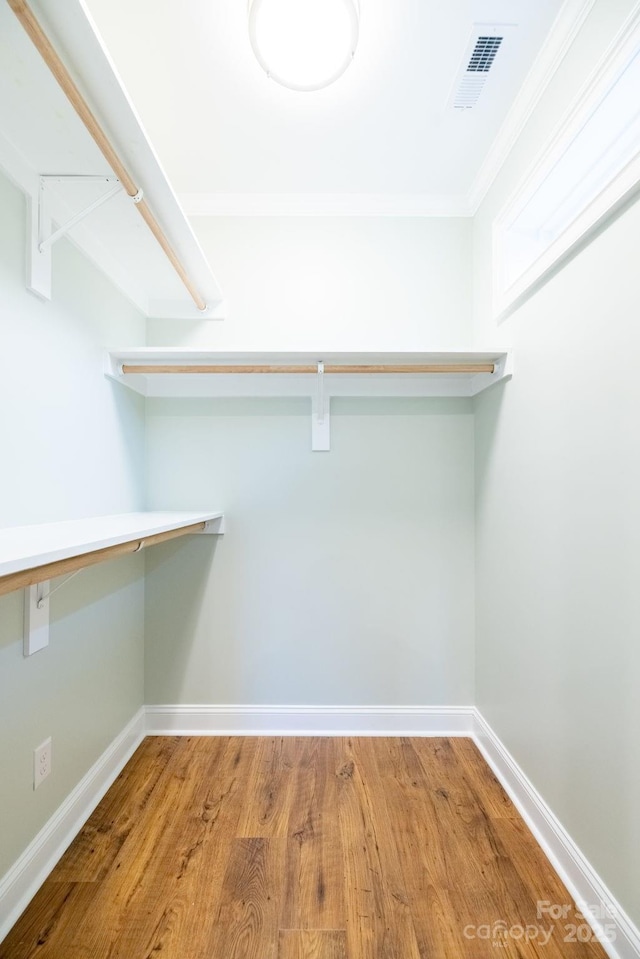 219 Grayson St, Sparta, NC 28675 - walk in closet featuring wood finished floors