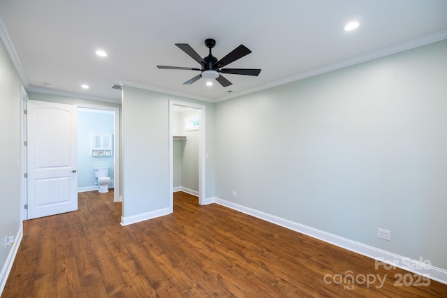 219 Grayson St, Sparta, NC 28675 - unfurnished bedroom with recessed lighting, a spacious closet, baseboards, crown molding, and dark wood finished floors
