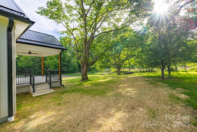 219 Grayson St, Sparta, NC 28675 - view of grassy yard featuring a ceiling fan and covered porch
