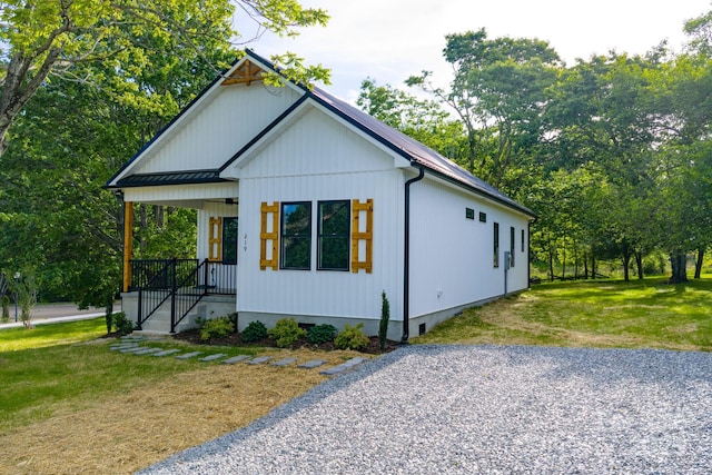 219 Grayson St, Sparta, NC 28675 - modern farmhouse style home with a front lawn, crawl space, metal roof, covered porch, and a standing seam roof