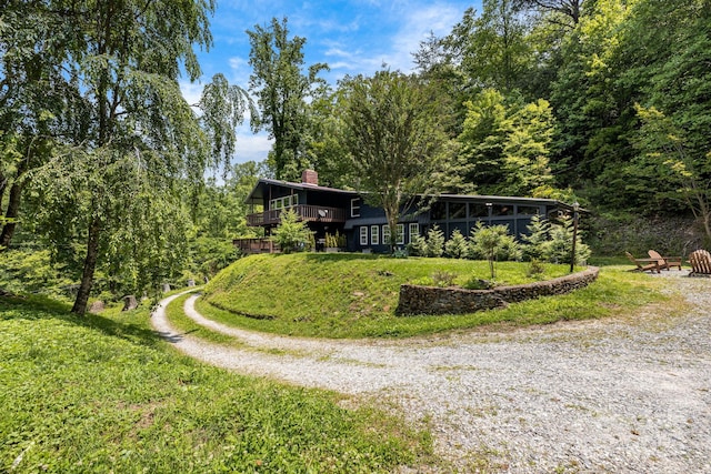 6541 Grassy Branch Rd, Bryson City, NC 28713 - view of front of home with a chimney, driveway, and a front lawn
