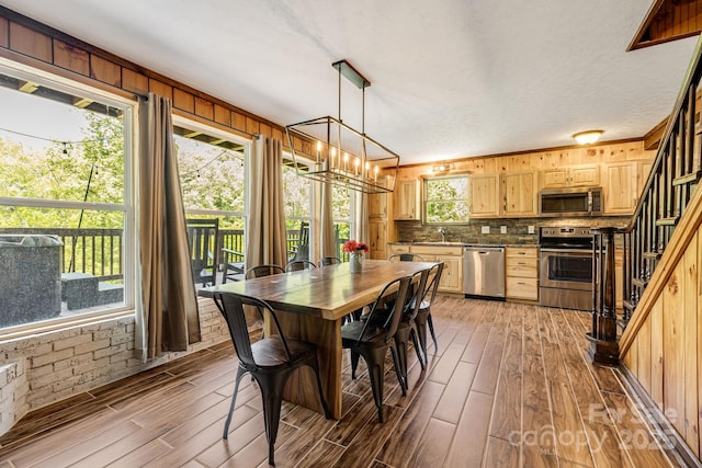 6541 Grassy Branch Rd, Bryson City, NC 28713 - dining space with light wood-style flooring, stairway, and a chandelier