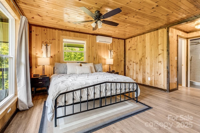 6541 Grassy Branch Rd, Bryson City, NC 28713 - bedroom with an AC wall unit, wooden ceiling, wood walls, and wood finished floors