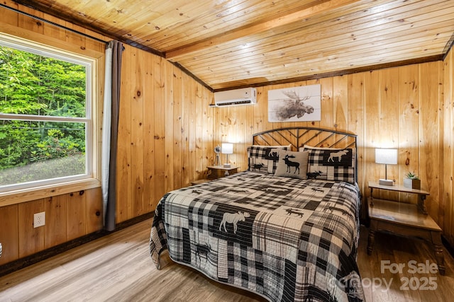 6541 Grassy Branch Rd, Bryson City, NC 28713 - bedroom featuring multiple windows, an AC wall unit, wood ceiling, wood finished floors, and wooden walls