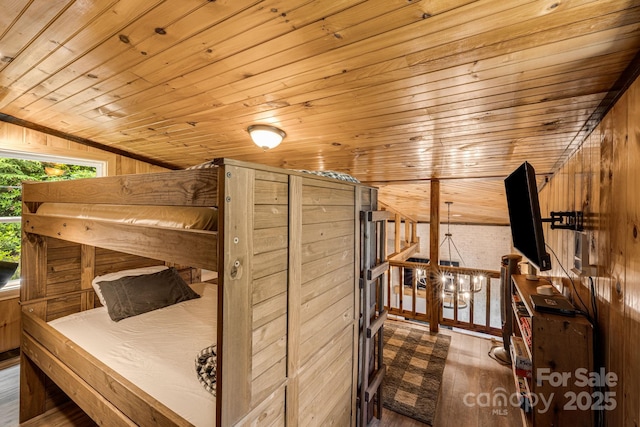 6541 Grassy Branch Rd, Bryson City, NC 28713 - unfurnished bedroom with wooden ceiling, vaulted ceiling, wood finished floors, and wood walls