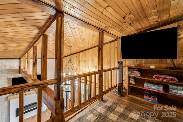 6541 Grassy Branch Rd, Bryson City, NC 28713 - corridor with wood ceiling, wood walls, an upstairs landing, a chandelier, and wood finished floors