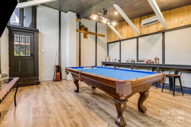 6541 Grassy Branch Rd, Bryson City, NC 28713 - playroom with wood finished floors, billiards table, a wood ceiling with exposed beams, wood walls, and a wall mounted air conditioner