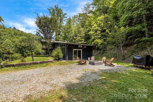 6541 Grassy Branch Rd, Bryson City, NC 28713 - view of yard with an outdoor fire pit and a wooded view
