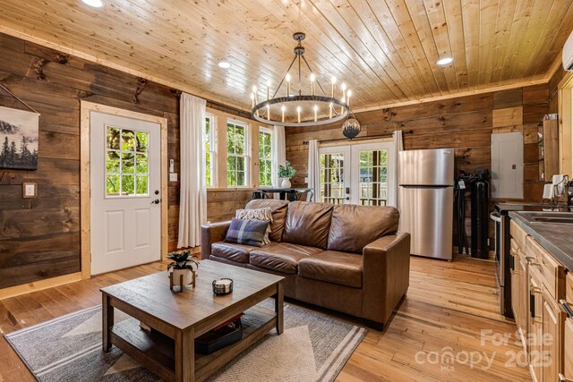6541 Grassy Branch Rd, Bryson City, NC 28713 - living area with wood walls, wood ceiling, french doors, recessed lighting, and a chandelier